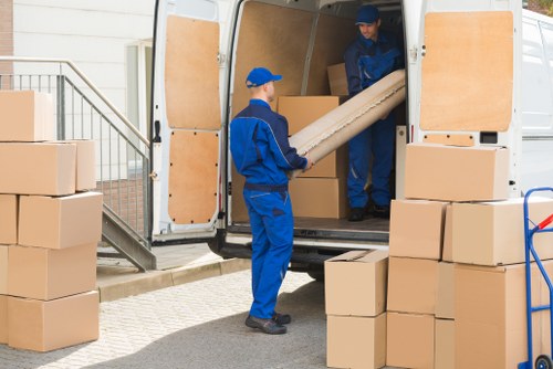 Moving boxes and furniture during removals in Brent
