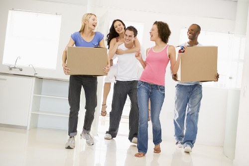 Student removals team handling boxes outside a Brent apartment building