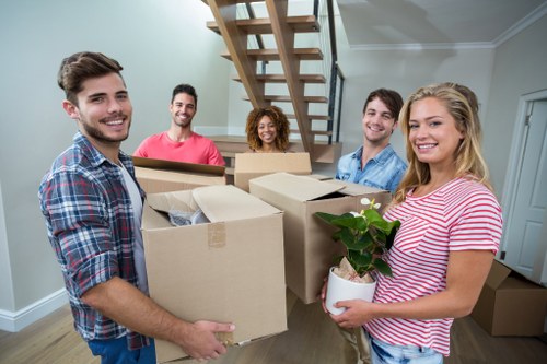 Professional house removalists in Brent loading moving boxes