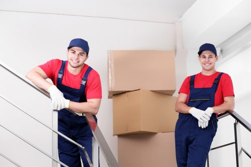 Removal team handling moving boxes during a booked house move