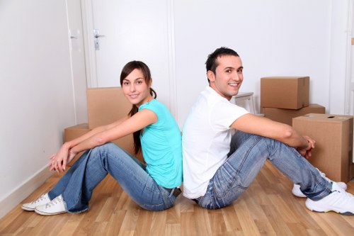 Brent removals team separating cardboard, wood, and metal for recycling