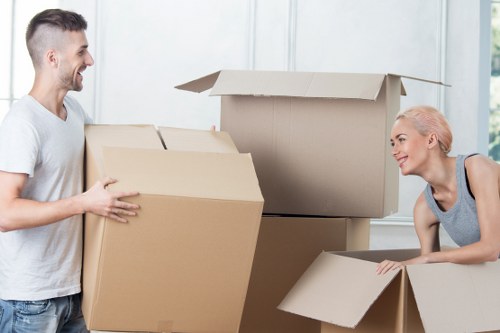 Packed moving boxes and furniture ready for removals in Brent