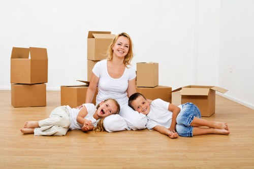 Professional movers handling furniture during a same day removal