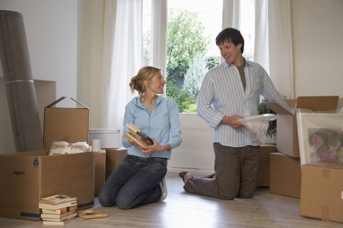 Removals crew handling furniture and boxes for a Brent property move