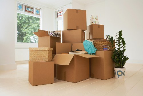 Loading furniture into a moving truck in Brent