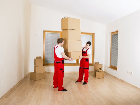 Room-by-room packing setup with labeled boxes for a Brent move