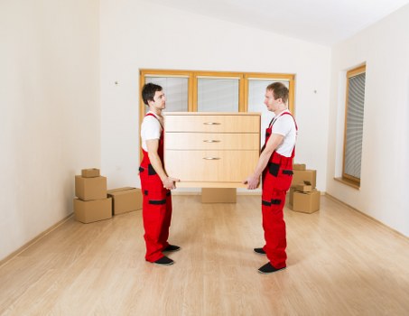 Loading furniture into a removal van in Brent