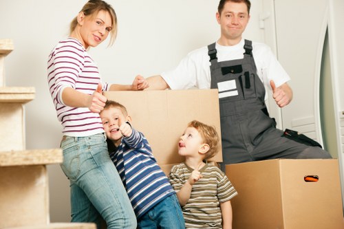 Careful loading of household items during a Brent flat relocation